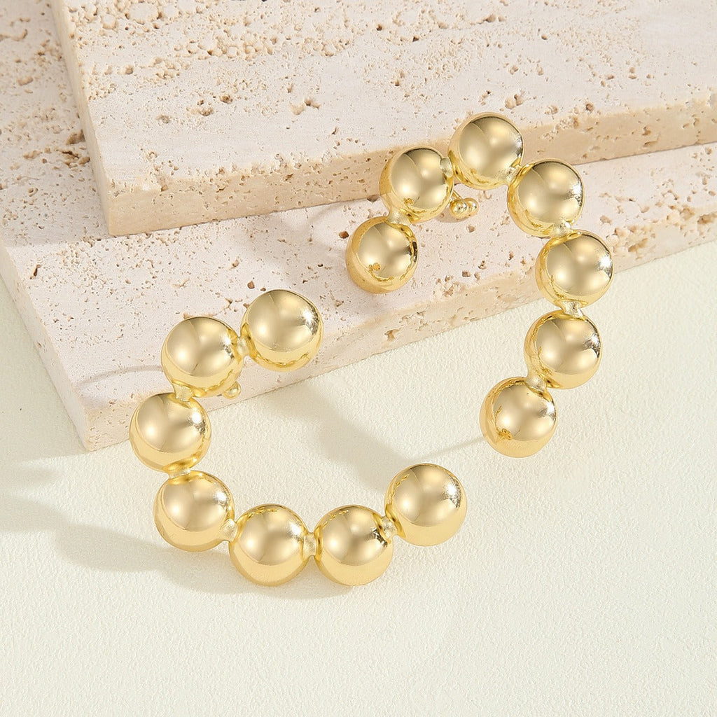 Women's Bracelet with Structured, Golden Beads