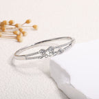 Women's Bangle with Elegant Infinity Pattern and Sparkling Zirconia