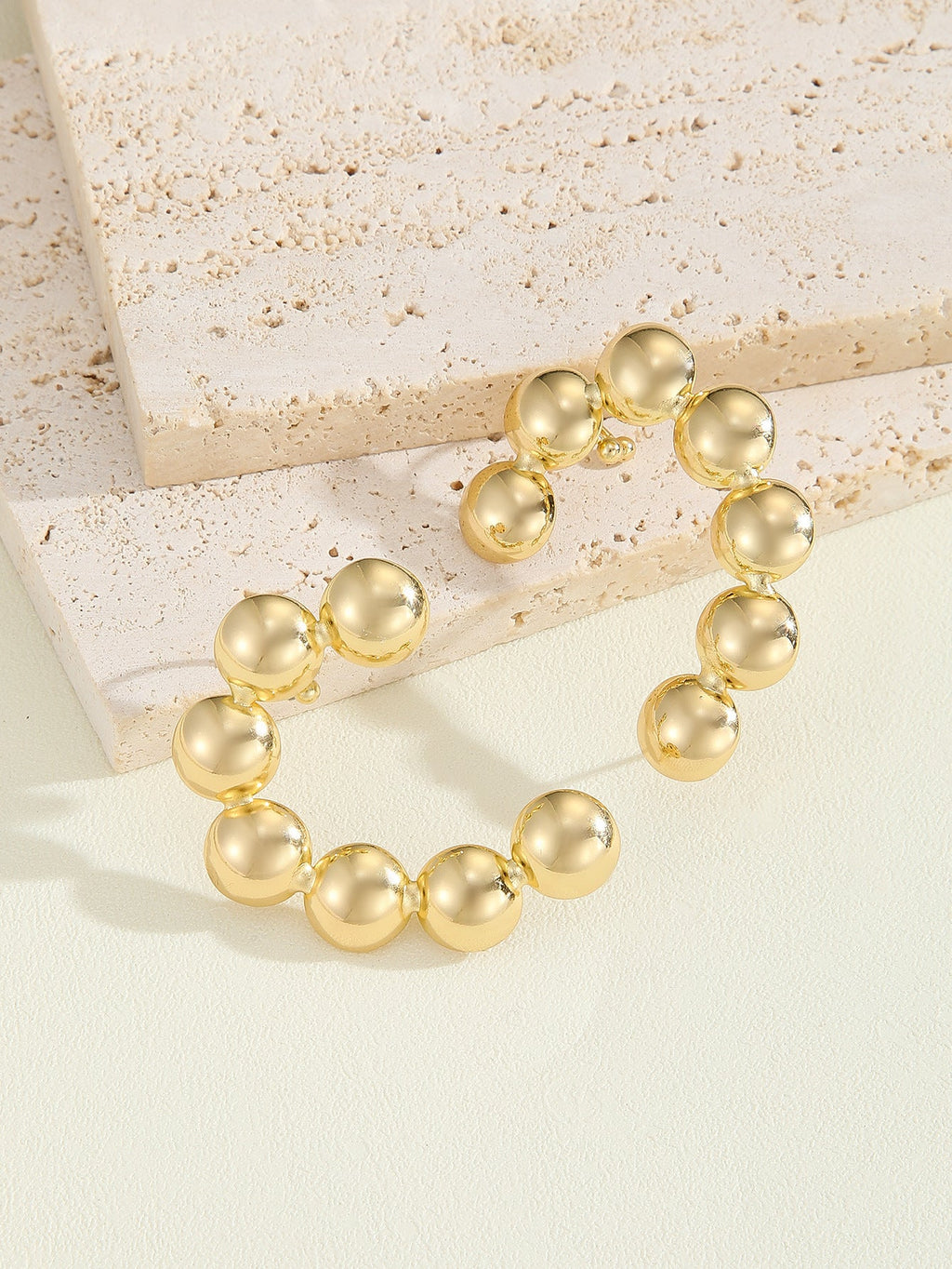 Women's Bracelet with Structured, Golden Beads