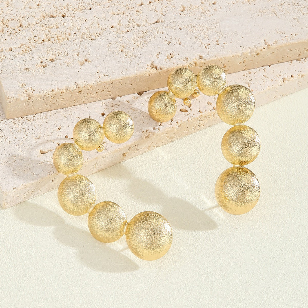 Women's Bracelet with Structured, Golden Beads