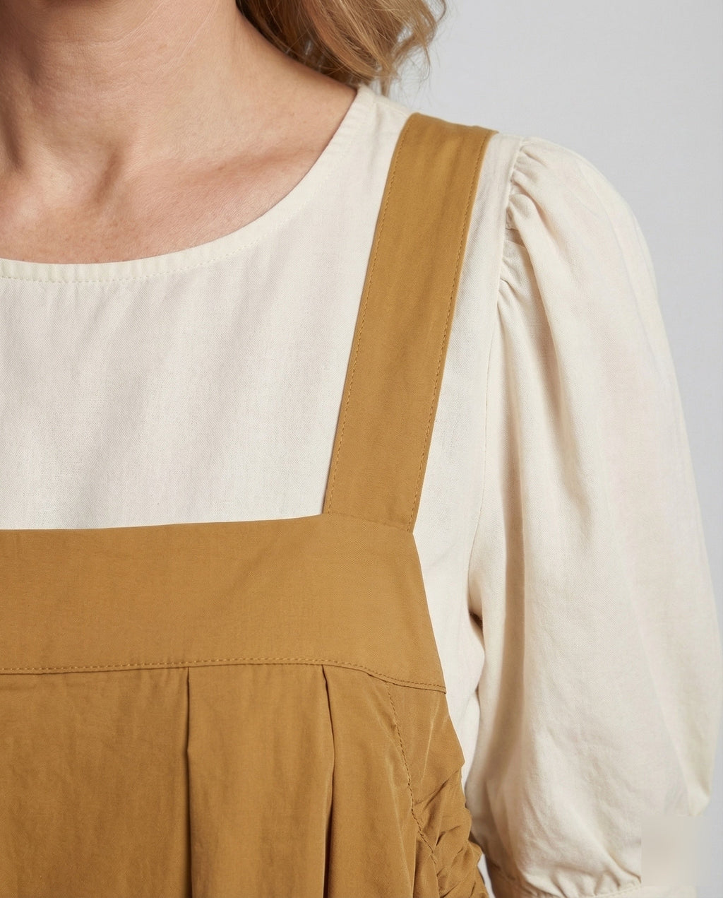 Women's Sleeveless Overall Dress with Pleated Skirt - Close-Up Detail
