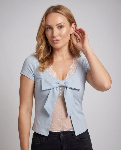 Women's Blouse with Playful Bow Design and Elegant Lace Embellishment - Upper Body View