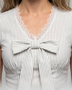Women's Blouse Shirt with Playful Bow Design and Ruffle Hem - Close-Up Detail