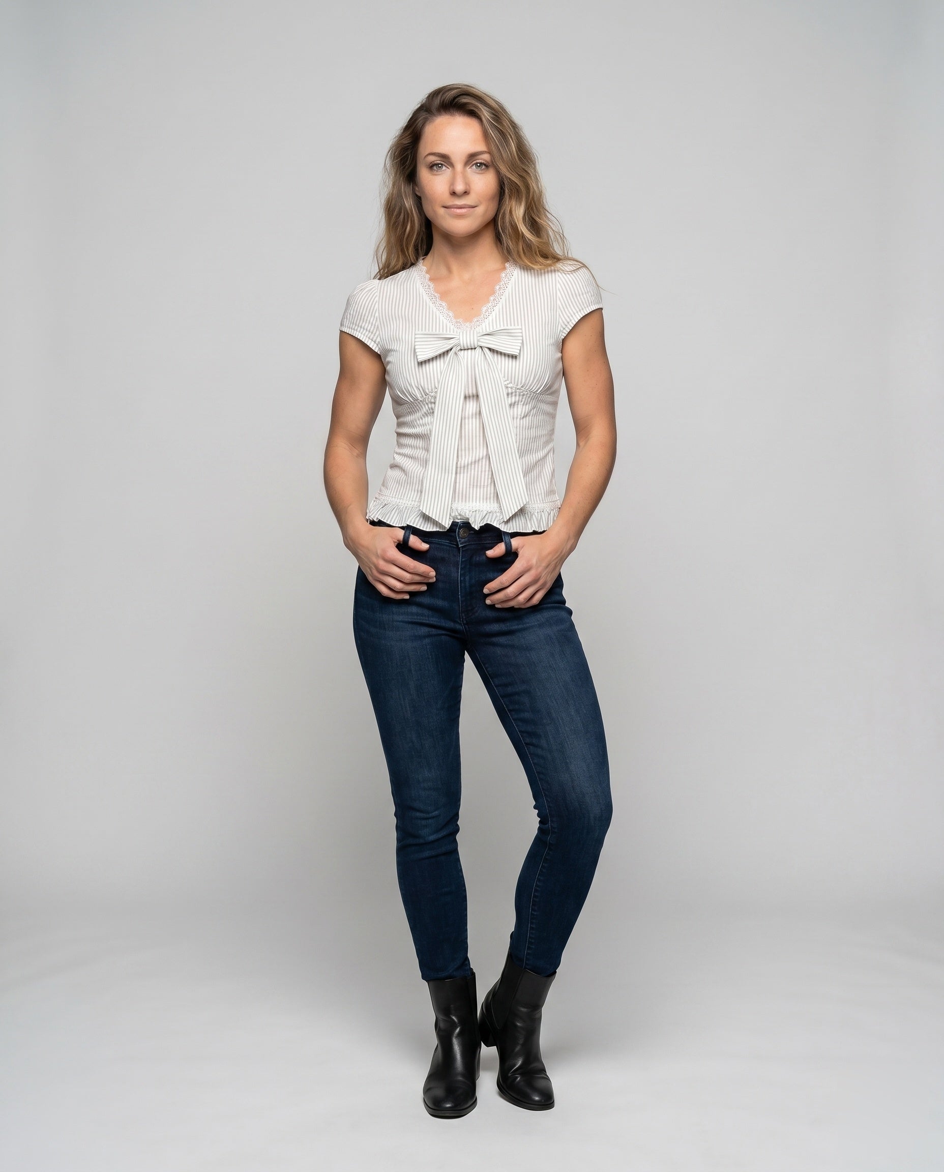 Women's Blouse Shirt with Playful Bow Design and Ruffle Hem - Front View