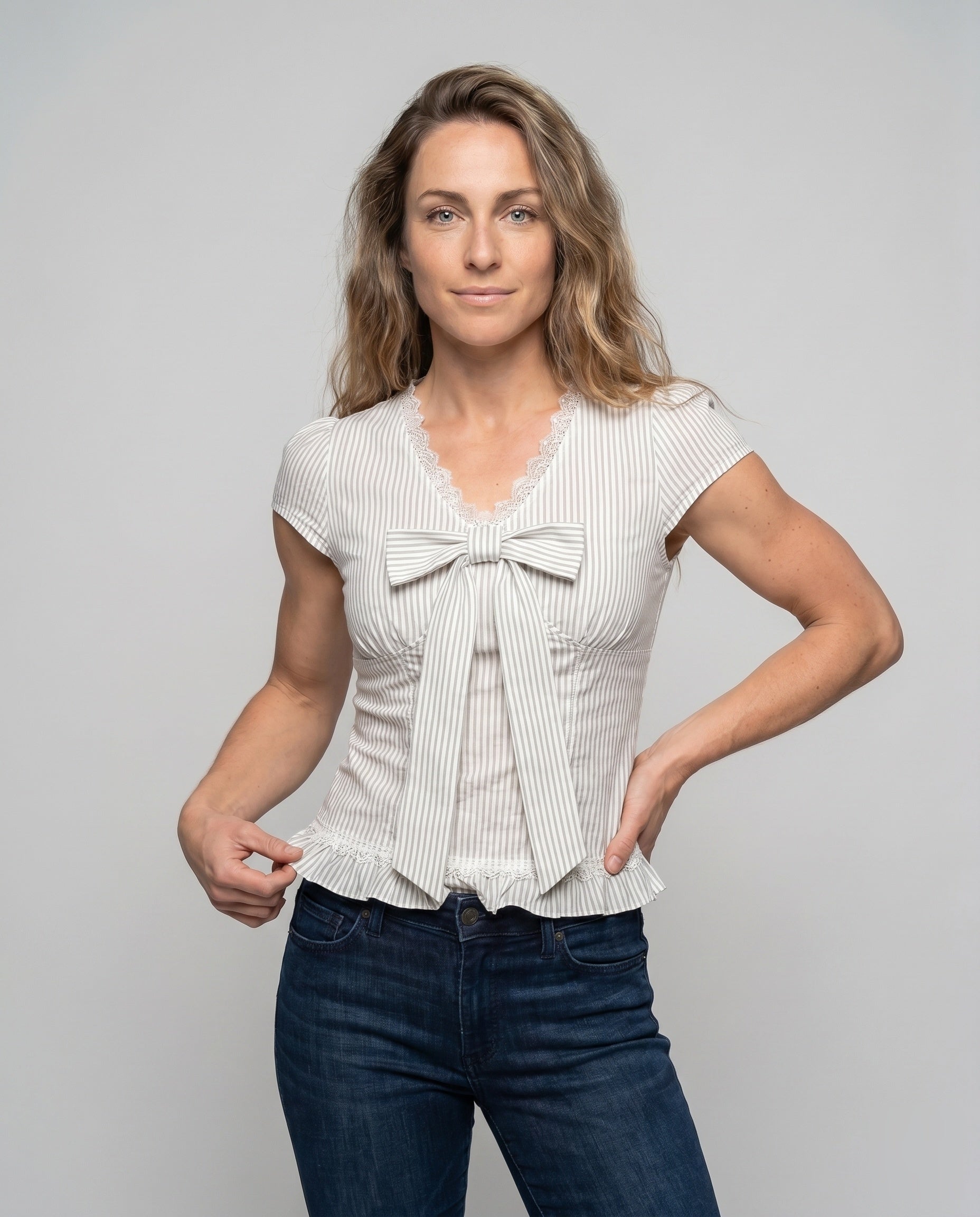 Women's Blouse Shirt with Playful Bow Design and Ruffle Hem - Upper Body View
