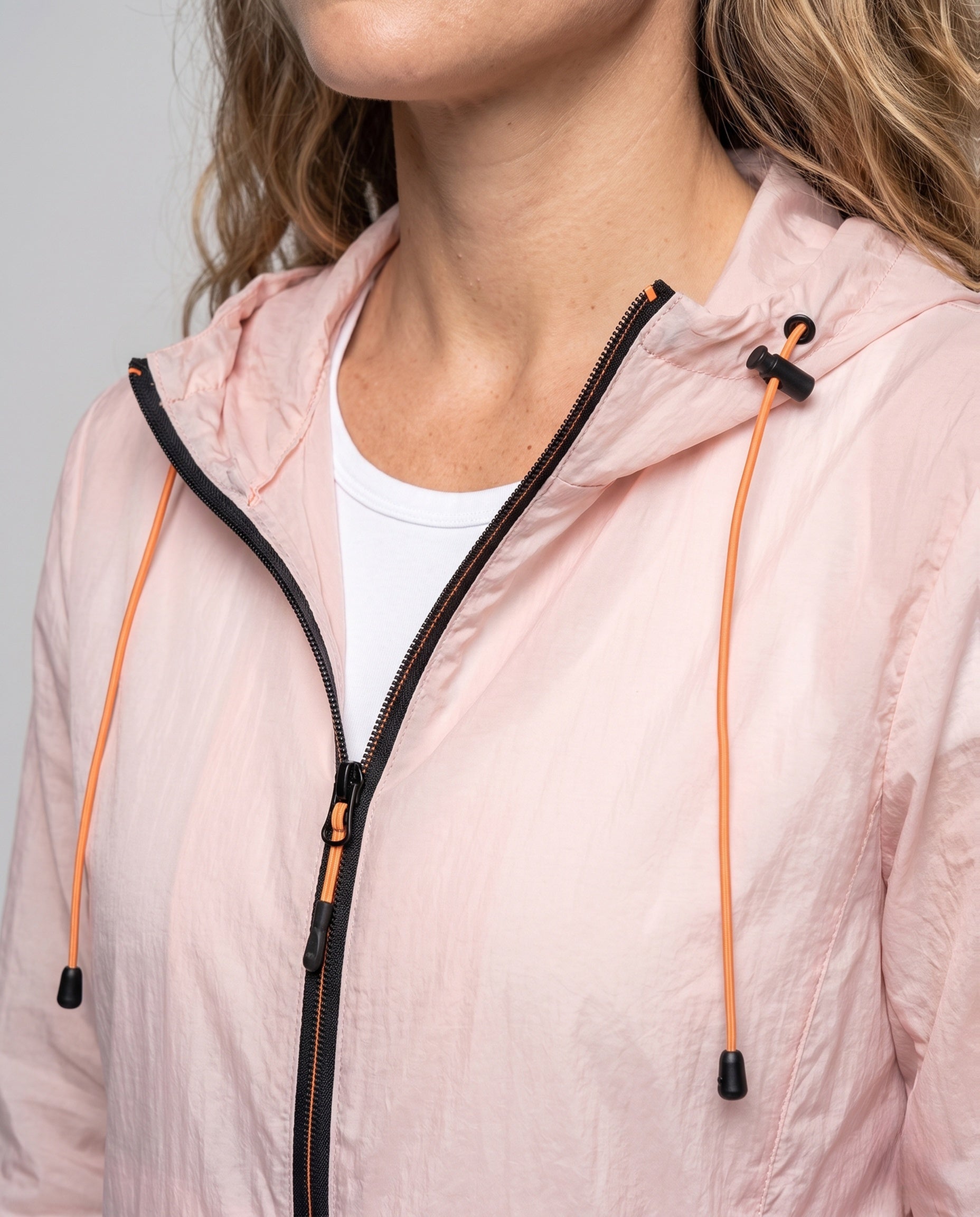 Women's Lightweight and Breathable Windbreaker with Adjustable Hood - Close-Up Detail