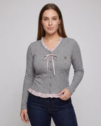Women's long sleeve blouse with playful ruffled hem and decorative loop design - Chichicherry